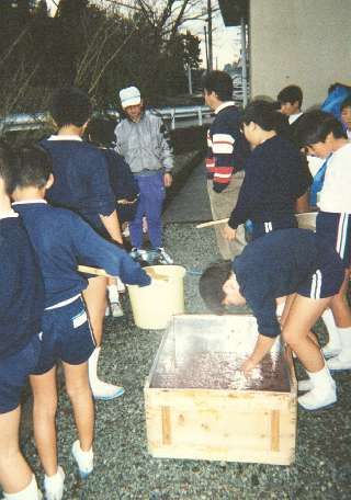 the students inspect their work